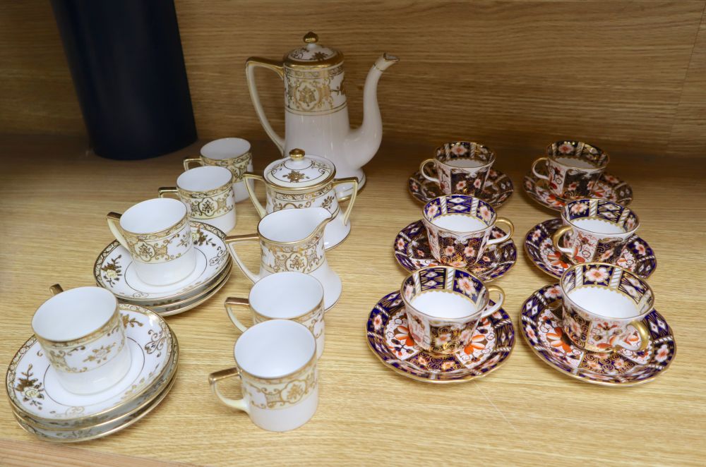 A set of six Royal Crown Derby miniature tea cups and saucers, date codes 1920s and a Noritake fifteen piece coffee service